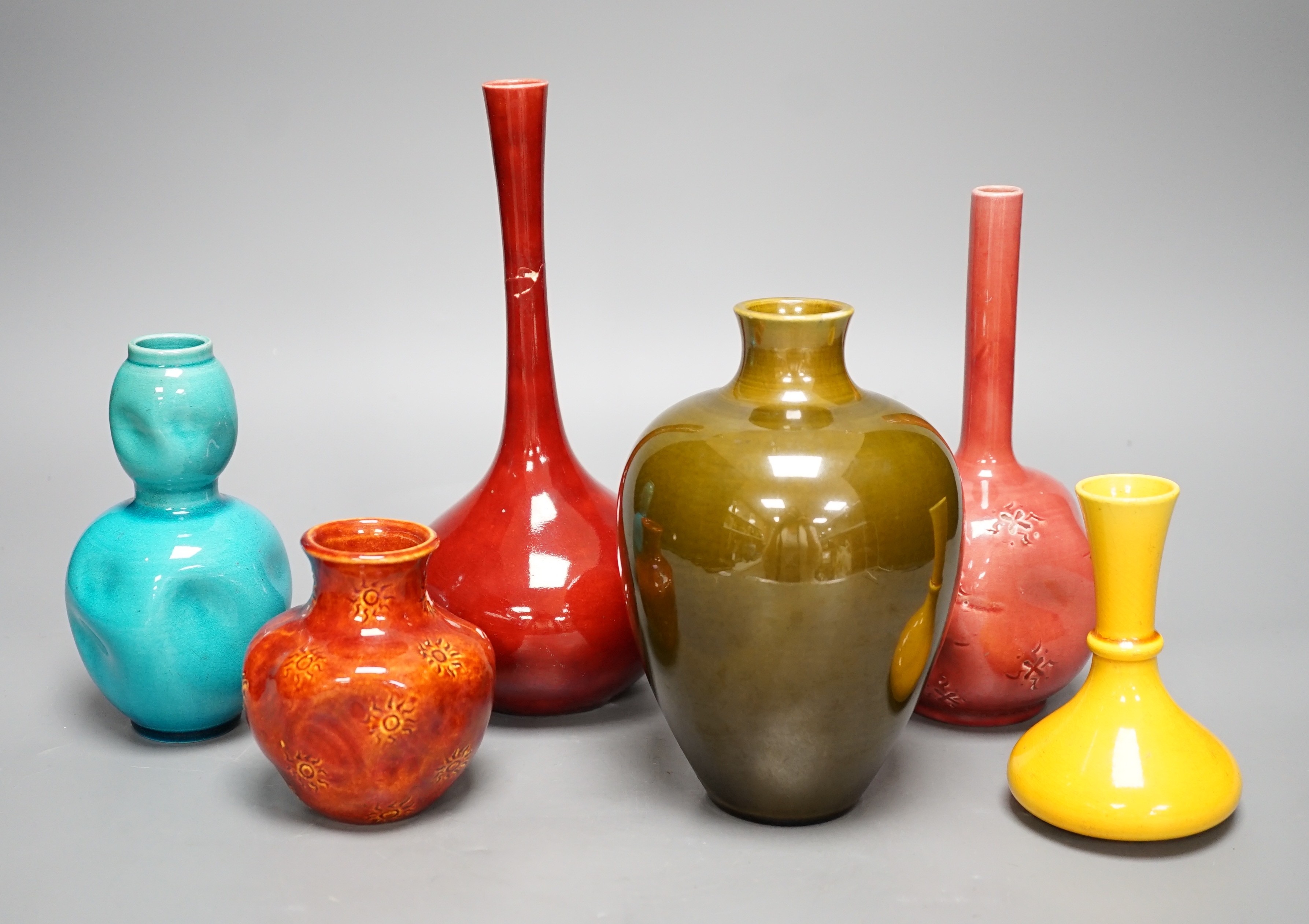 Six various Burmantoft Faience vases, tallest 22cm